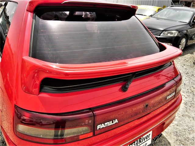 中古車 マツダ ファミリア 1 5 インタープレー Dohc 5mt 低走行 社外aw リアスポ の中古車詳細 32 130km レッド 兵庫県 59 8万円 中古車情報 中古車検索なら 車選びドットコム 車選び Com