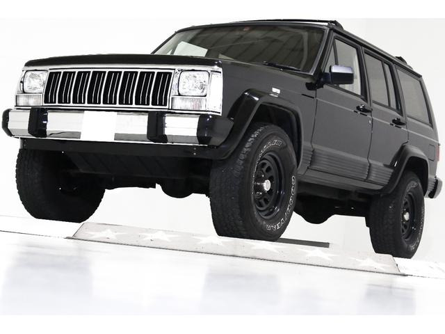 チェロキーリミテッド 4WDリフトアップ 内装ベージュ本革電動シート 背面レス車