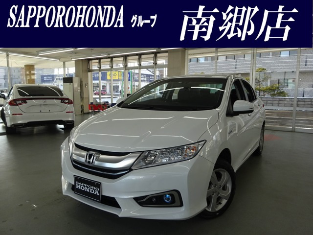 中古車 ホンダ グレイス 1 5 ハイブリッド Ex 4wd の中古車詳細 44 000km パールホワイト 北海道 129万円 中古車情報 中古車検索なら 車選びドットコム 車選び Com