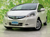 【中古車情報】ホンダ フィットハイブリッド 1.3 10th アニバーサリー  の中古車詳細（走行距離：10.7万km、カラー：プレミアムホワイト・パール、販売地域：奈良県橿原市）
