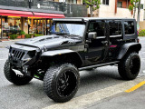 ラングラー アンリミテッド スポーツ 4WD CALIFORNIA MUDSTARカスタム/AMP電動サイド