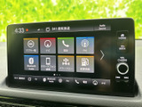 ナビや電話、FM、Bluetooth Audioなどのメニューが並び、使いたい項目を選びやすい画面です。燃費情報なども確認でき、日々の移動に便利な機能がまとまっています。