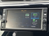 音源選択の画面にテレビの項目があり、停車中に番組を視聴したい場面で活用できます。FM・AMやBluetooth Audioなどの選択肢も並び、用途に合わせて音源を選びやすい案内表示です。